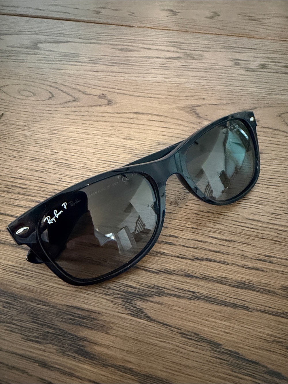 Ray-Ban Black Frame New Wayfarer Classic Sunglasses with gradient gray lenses